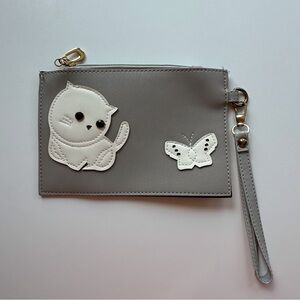 Light gray faux leather zippered wristlet strap. Cute white cat butterfly detail